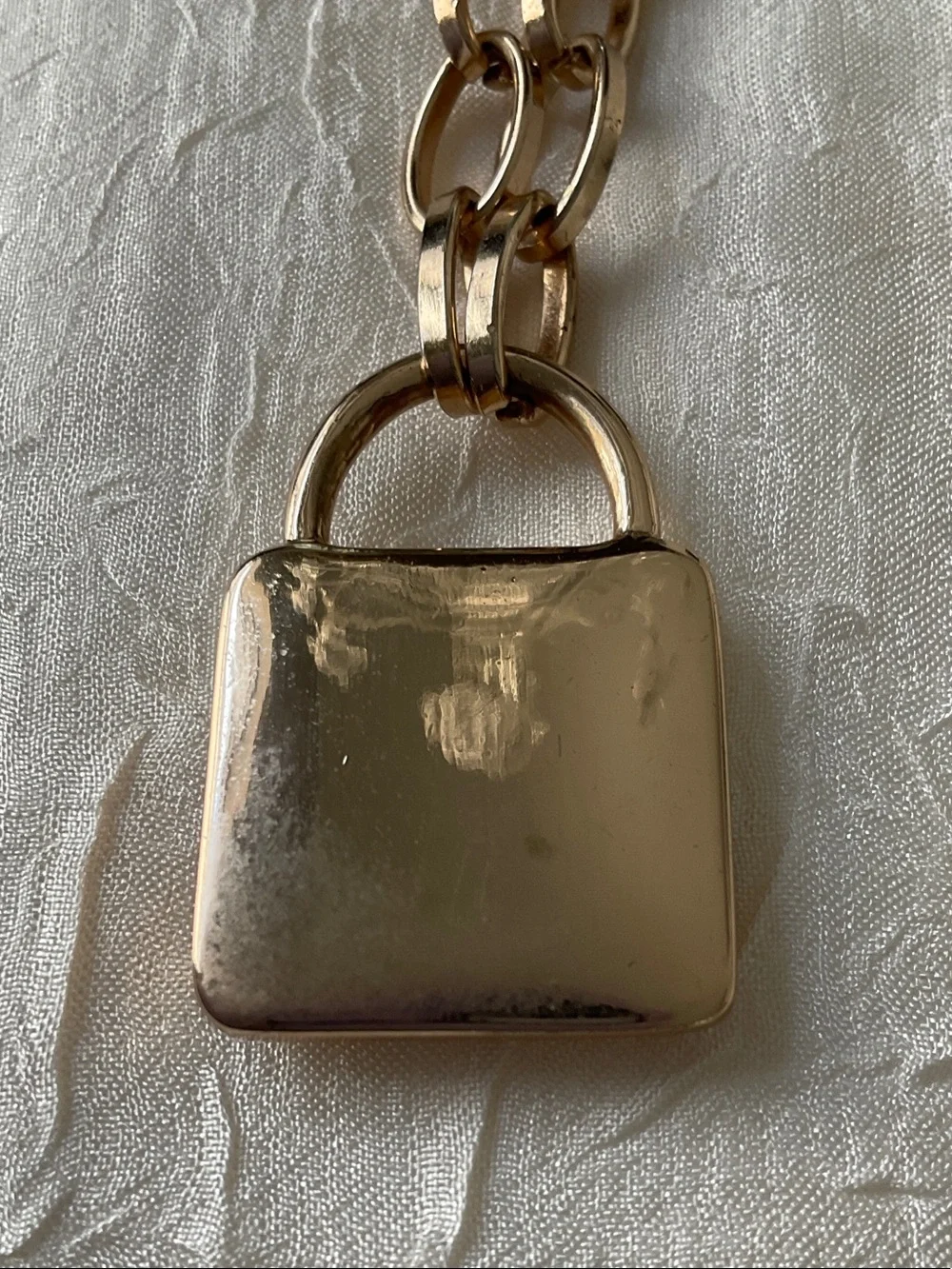 GUESS Gold Padlock Pendant with Floral Accent